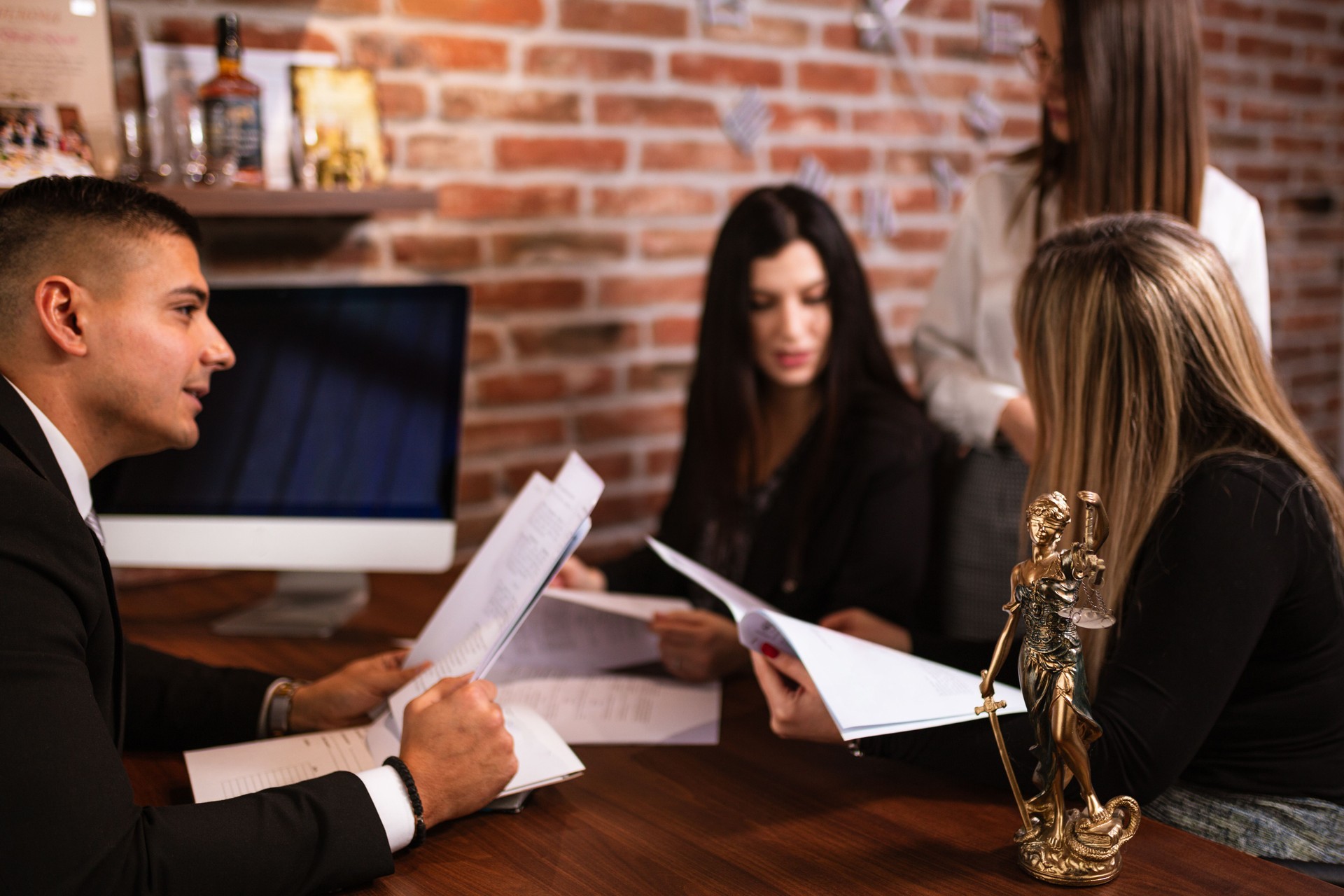 Lawyer Discussing Case with Clients at the Office